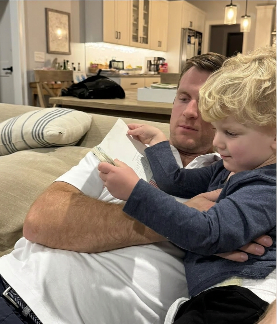 Owen reading with dad