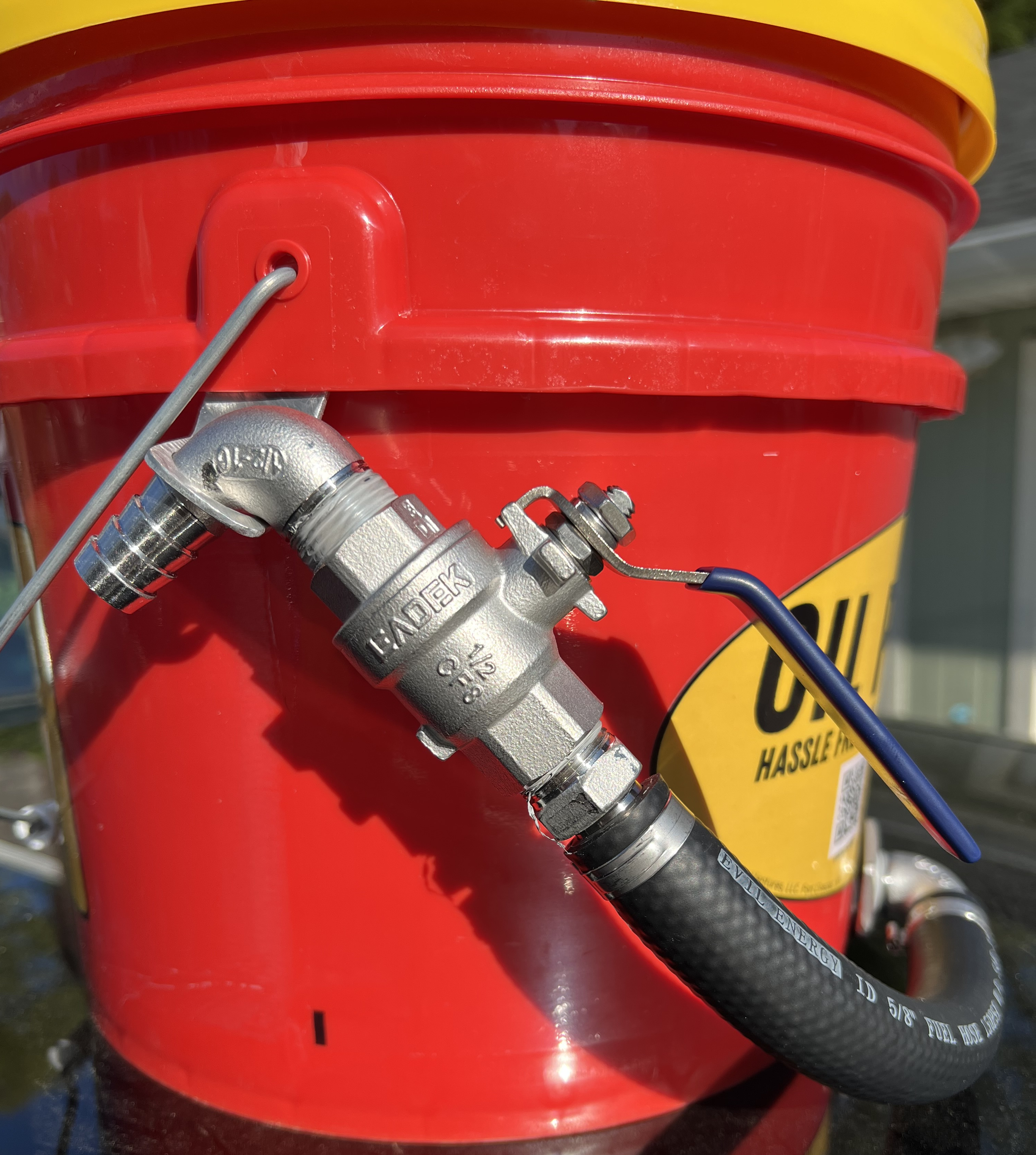 Close-up side view of Oil Pal with valve secured in its holster
