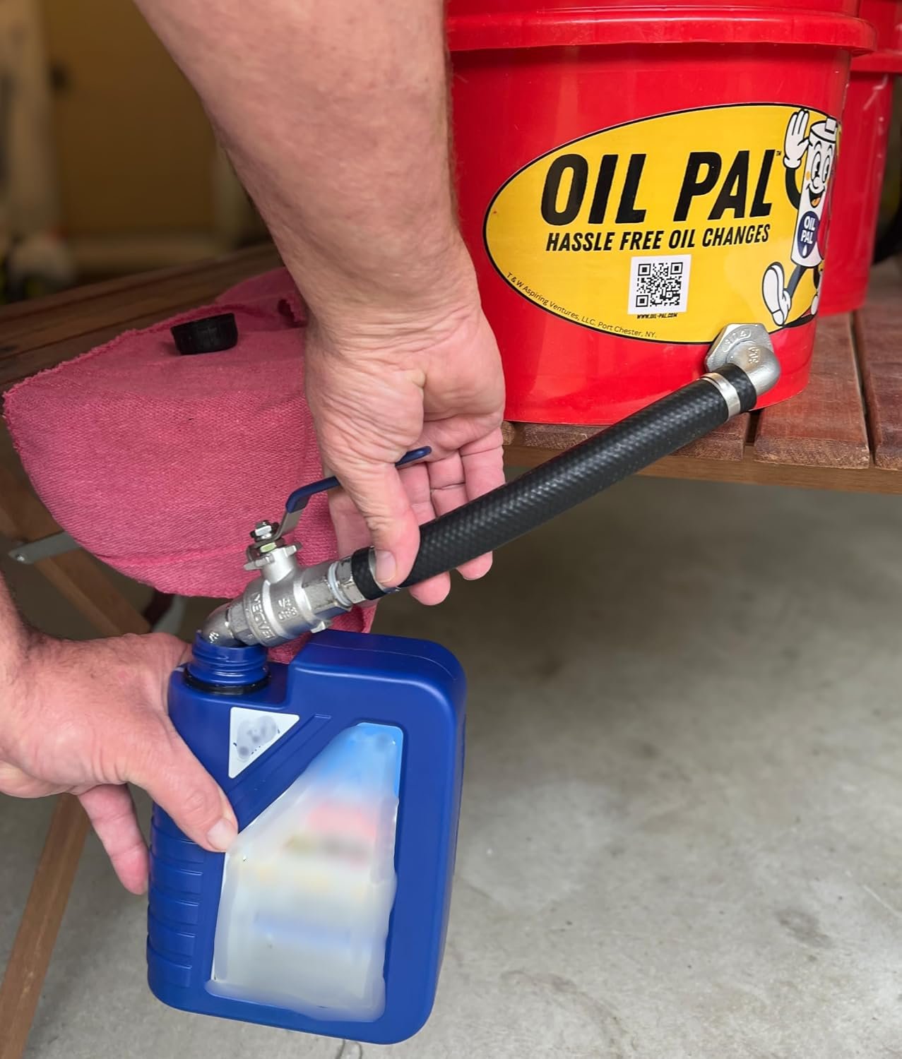 Close-up of Oil Pal valve pouring into a recycling container