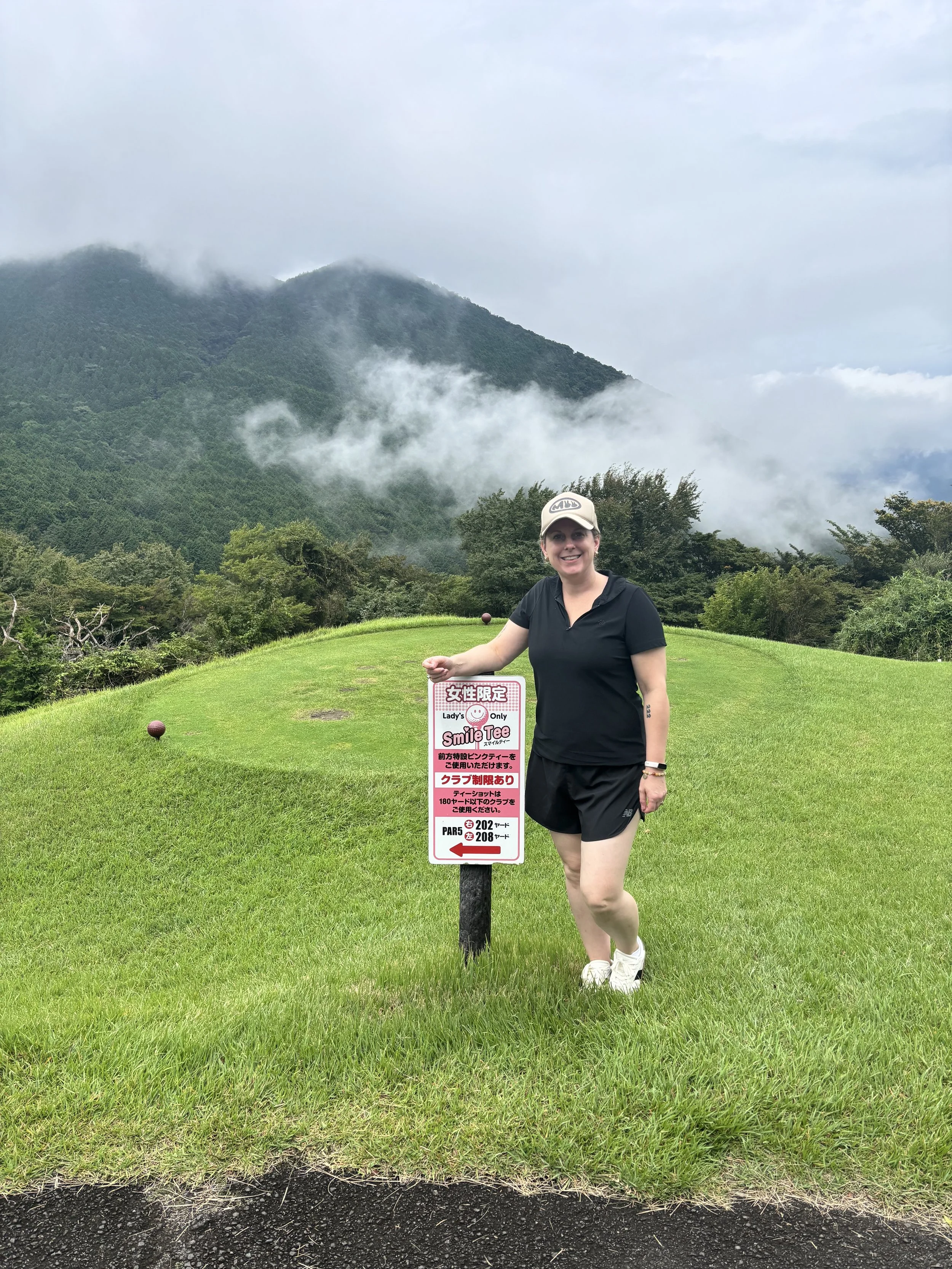 Gina golfing in Japan