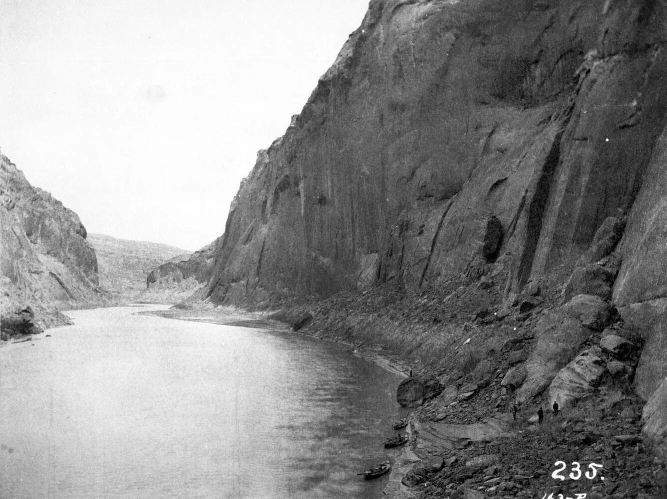 The Colorado River in bare canyon at the future Glen Canyon Dam site, photographed in 1889