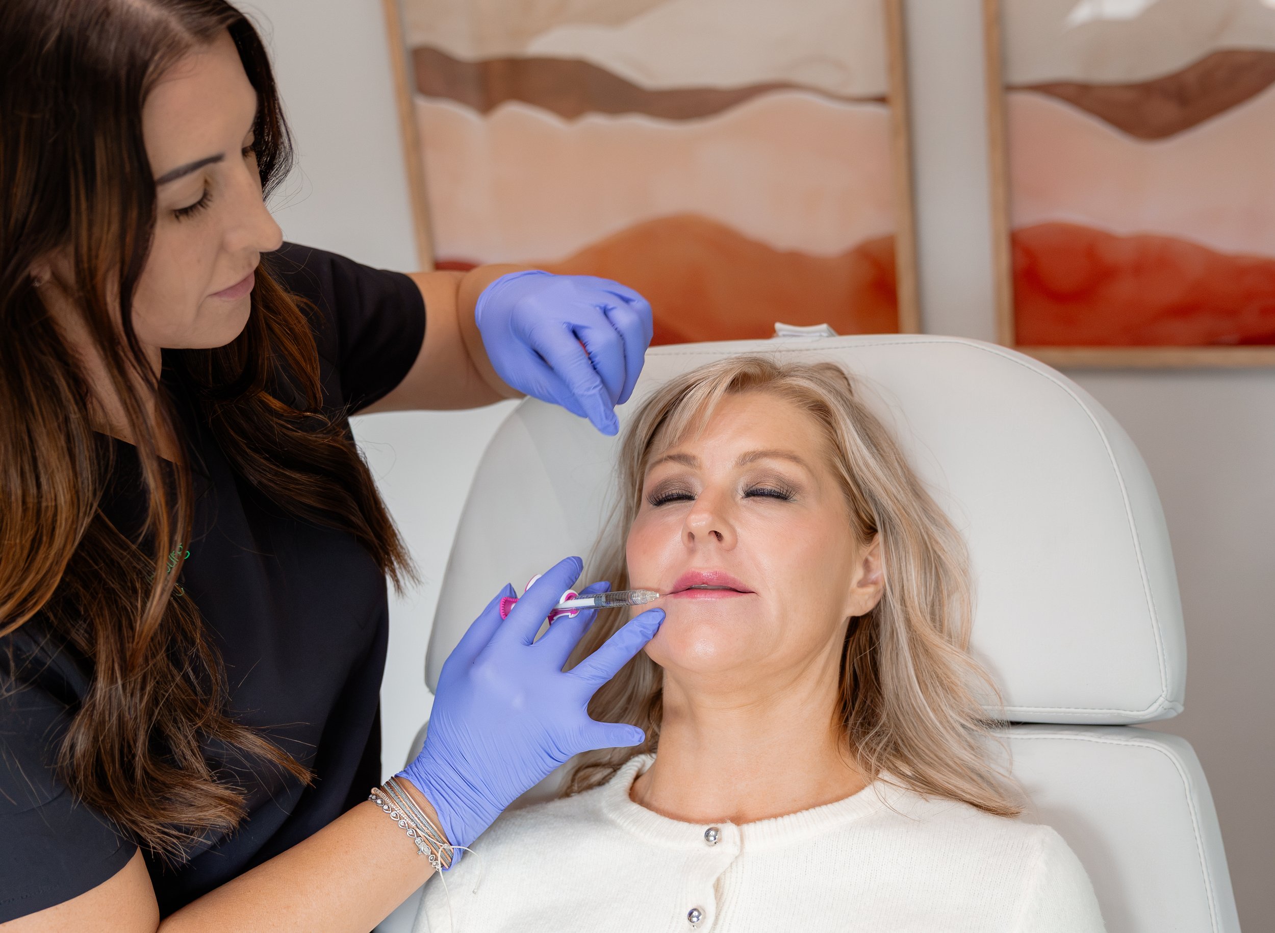 Brittany Ellenburg Nurse Practitioner Well Aesthetics Waynesville NC with patient