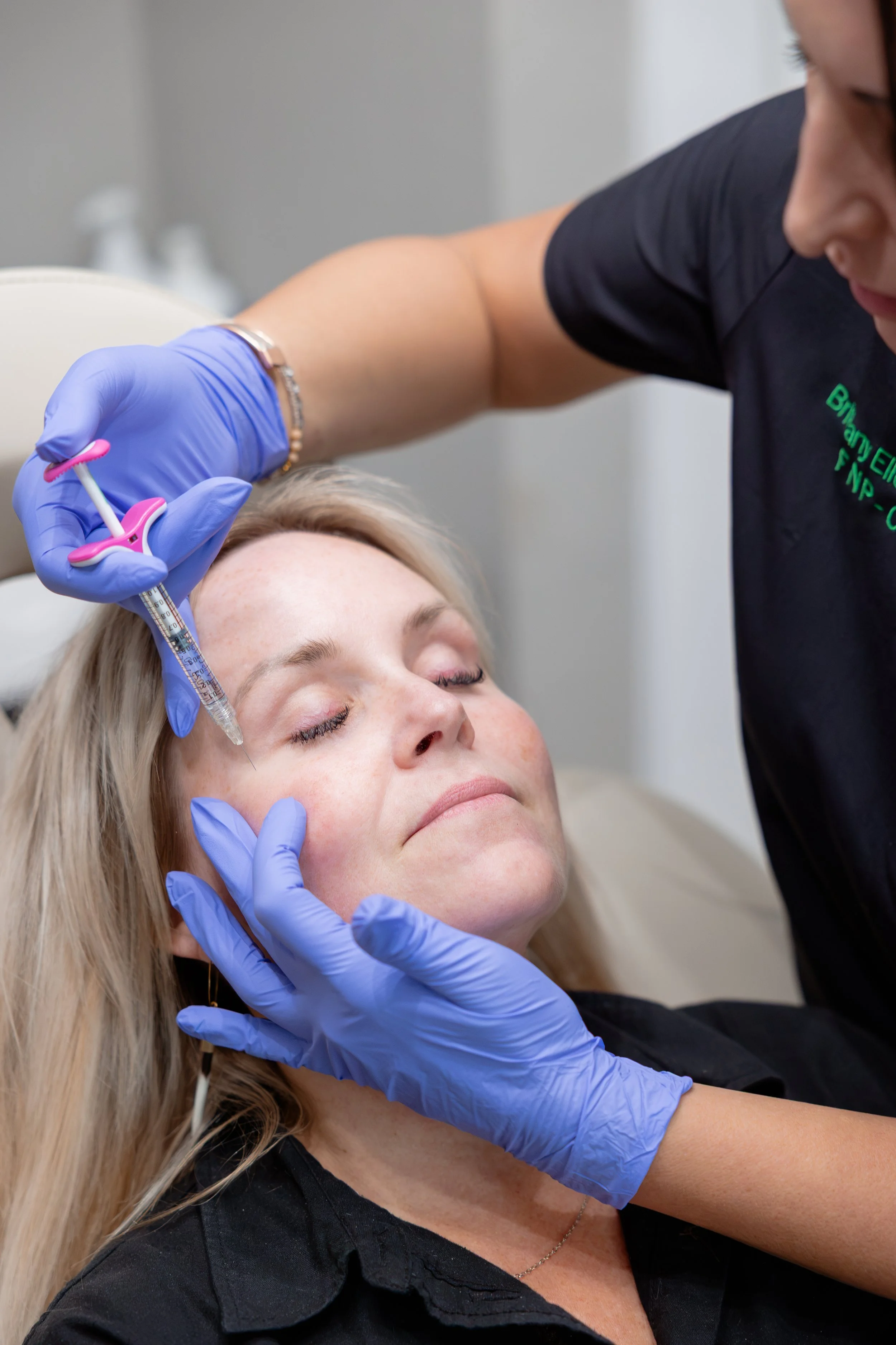 Dermal filler consultation at Well Aesthetics in Waynesville, NC featuring JUVÉDERM lip filler treatment.