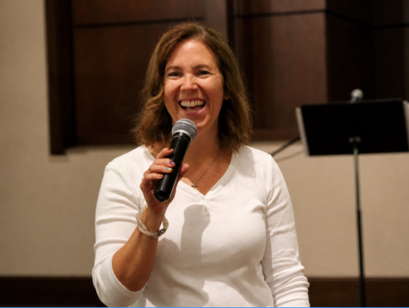 Elaine Pendergrass speaking with a microphone