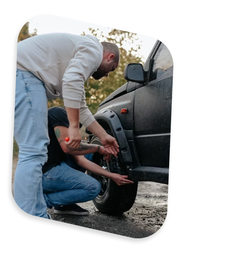 A person changing a car tire