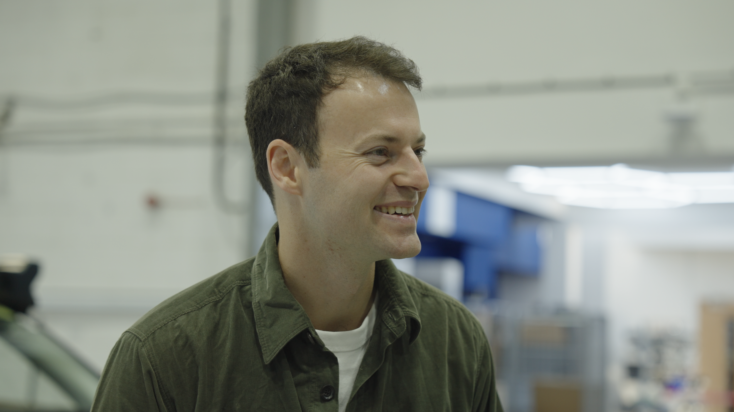 Alex Kendall, Wayve's co-founder and CEO, smiling during filming.