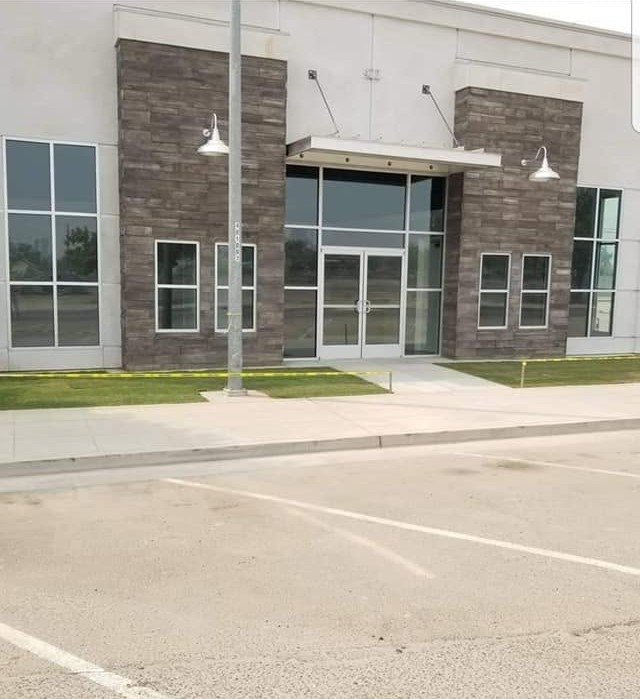 Commercial office building frontage maintained by Specialty Landscape in Kerman