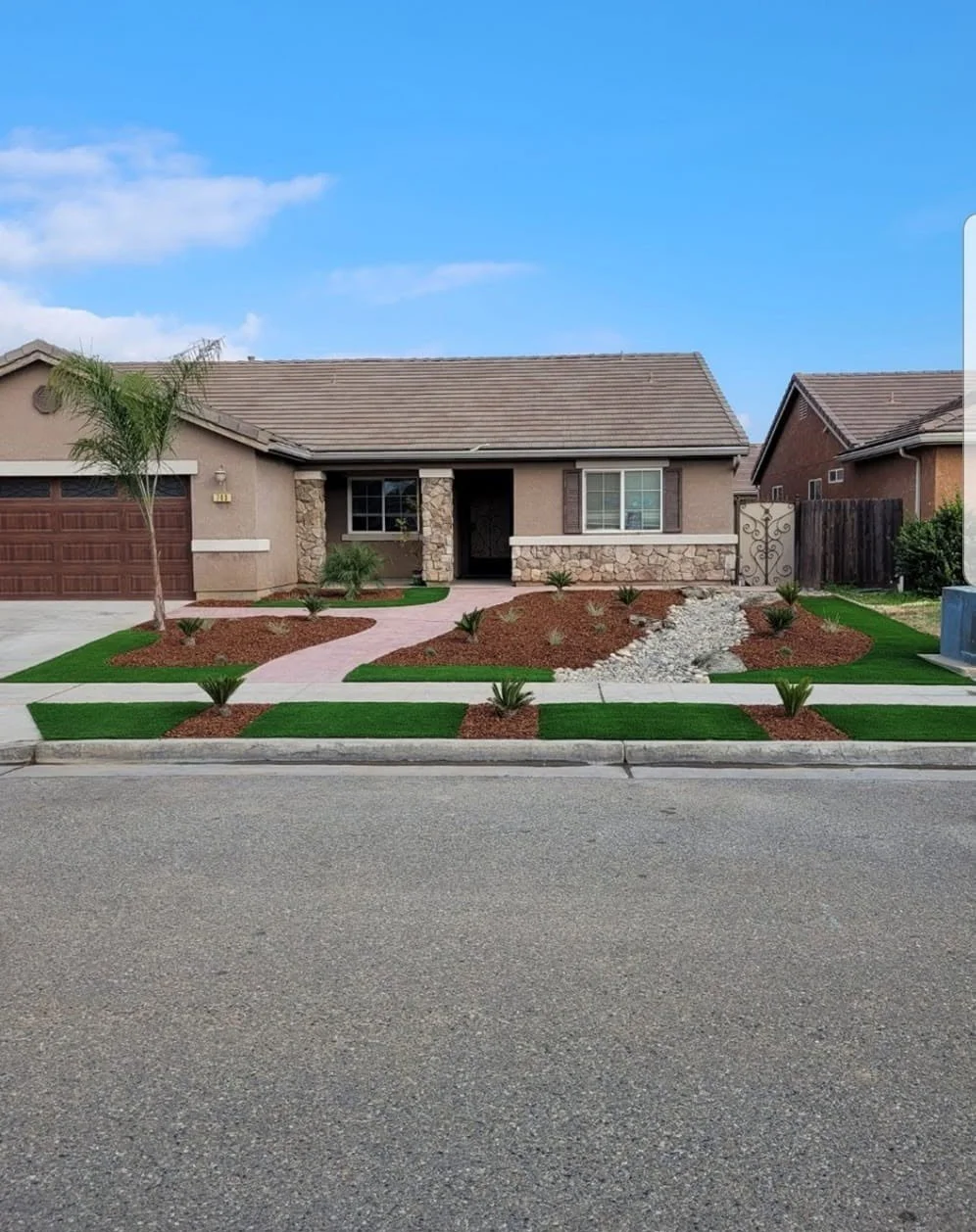 Weed-free front turf and mulch beds kept up by Specialty Landscape