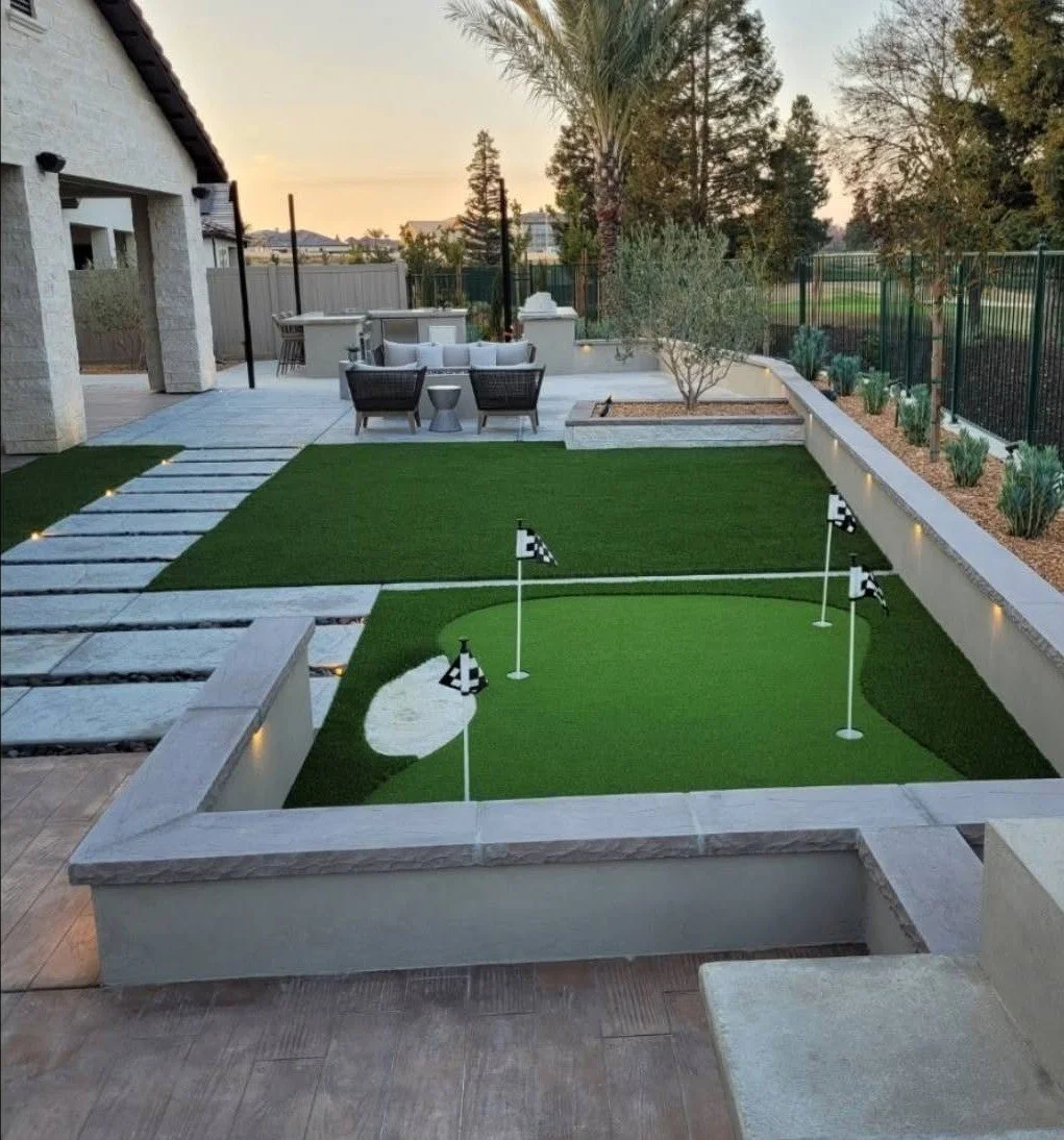 Synthetic putting green with seating built by Specialty Landscape