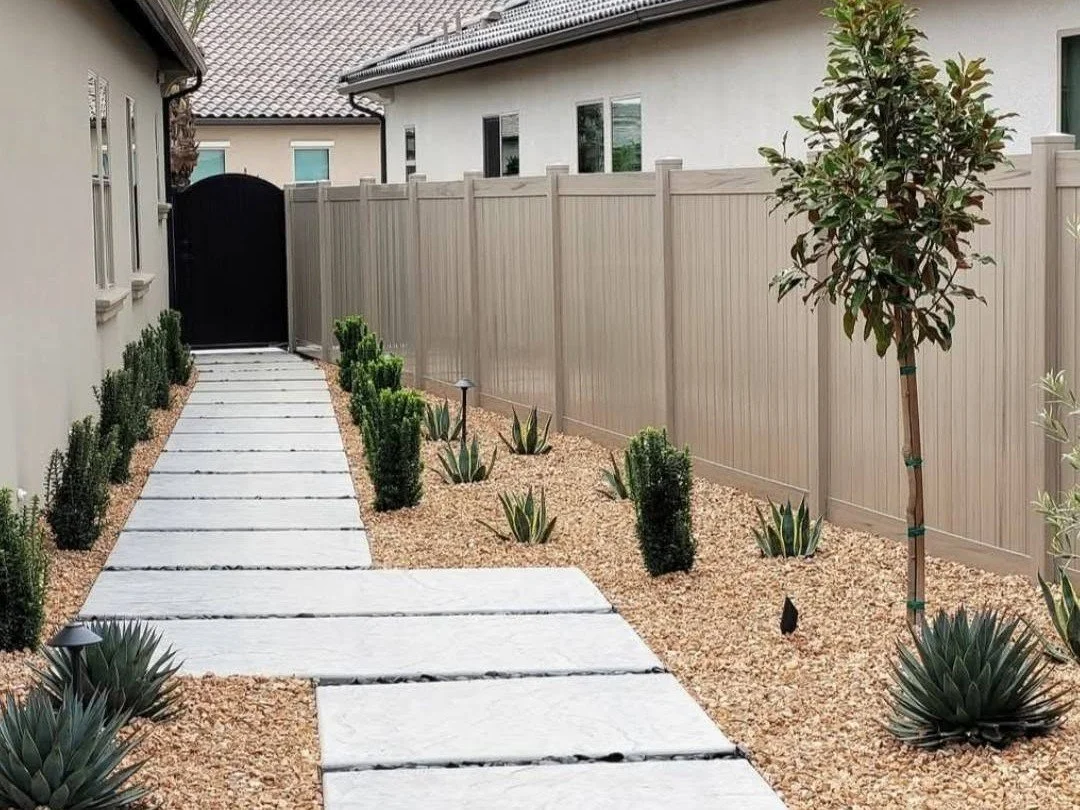 Paver walkway running along the side yard of a Fresno home by Specialty Landscape