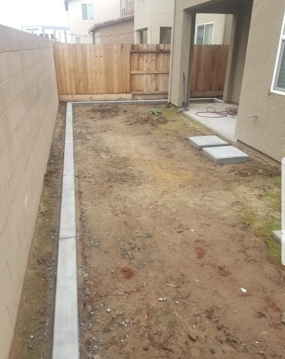 Concrete mow strip formed and poured on a prepared base by Specialty Landscape