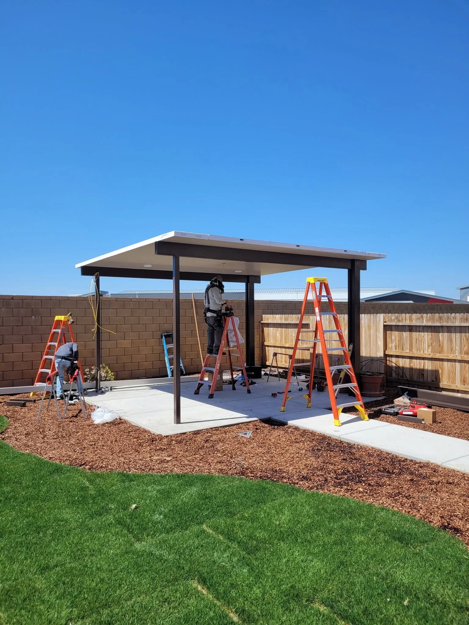 Alumawood patio cover under construction by Specialty Landscape