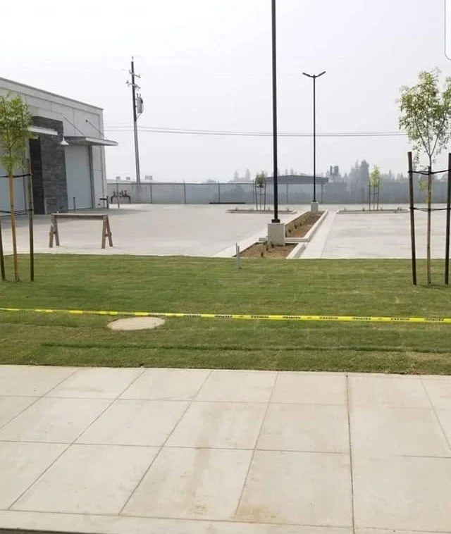 Commercial lawn and parking lot grounds maintained for a Tulare business by Specialty Landscape