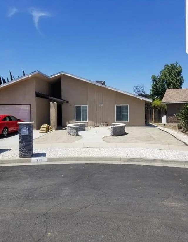 New concrete driveway and front approach poured by Specialty Landscape