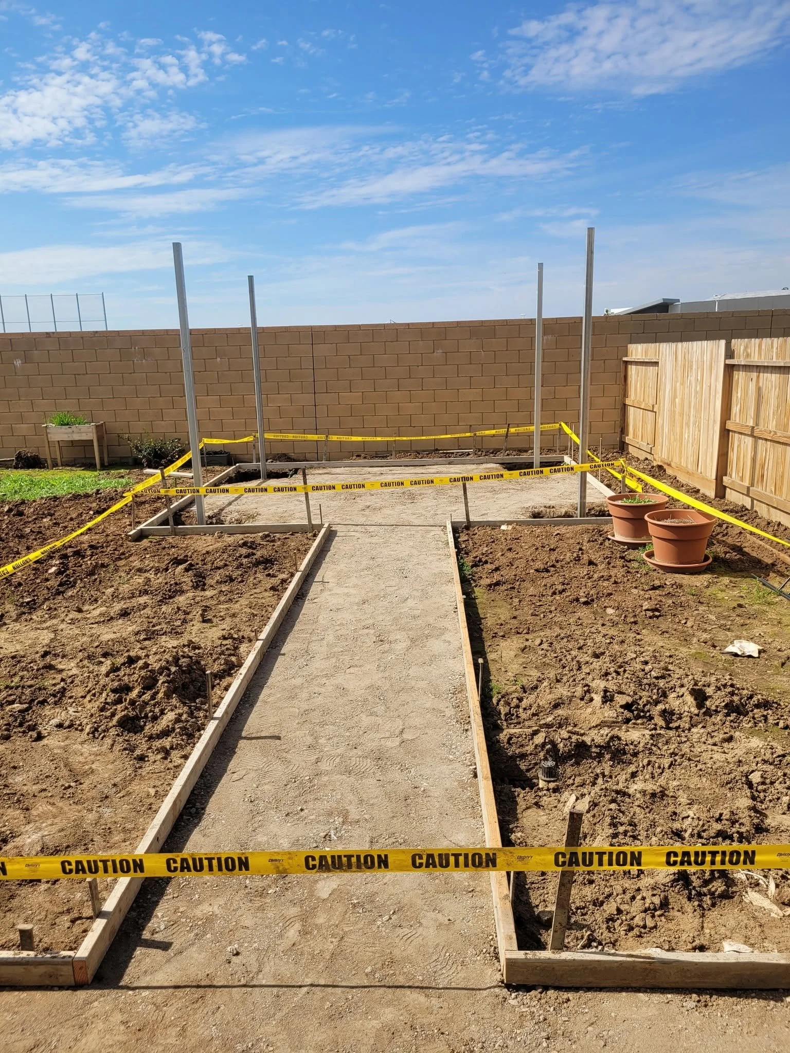 Concrete forms and string lines set out for a new landscape installation