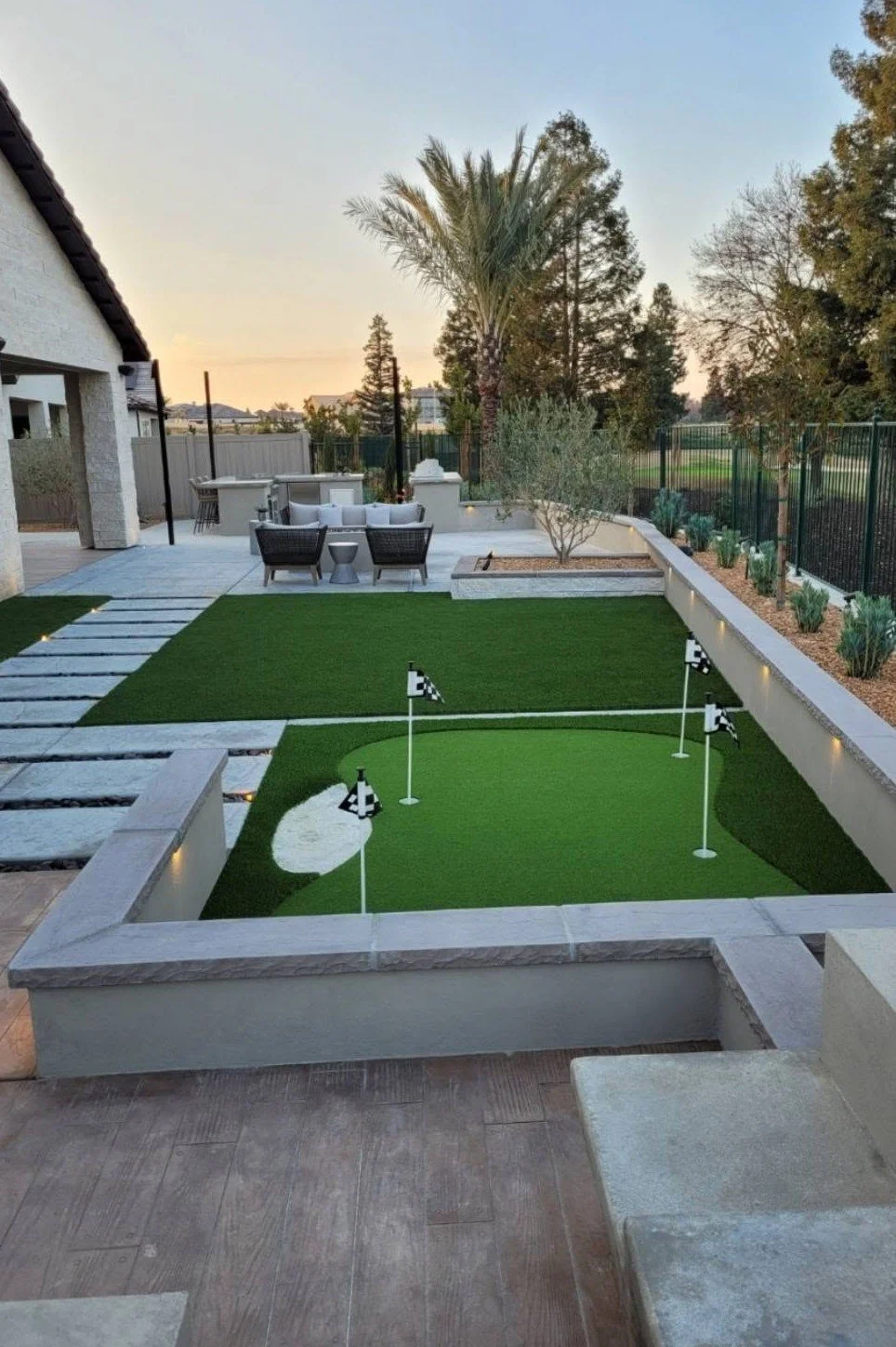 Synthetic putting green with flags built by Specialty Landscape