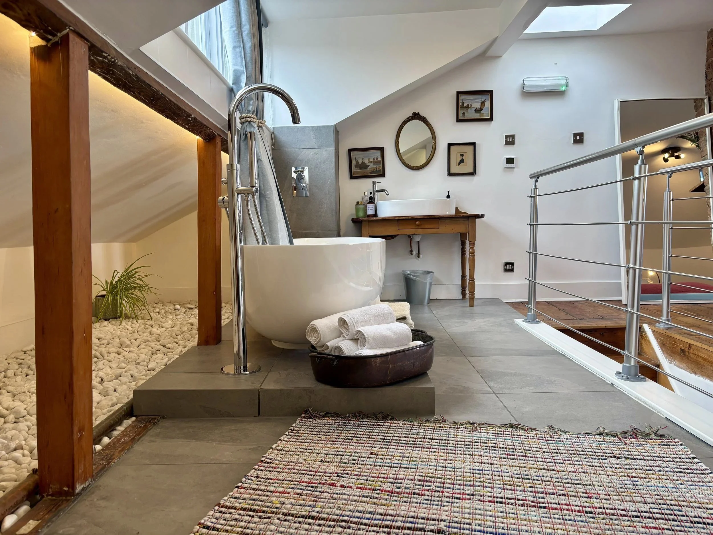 Freestanding bath in Room 101, the top-floor private ensuite studio at Central Victorian House in Camden Town