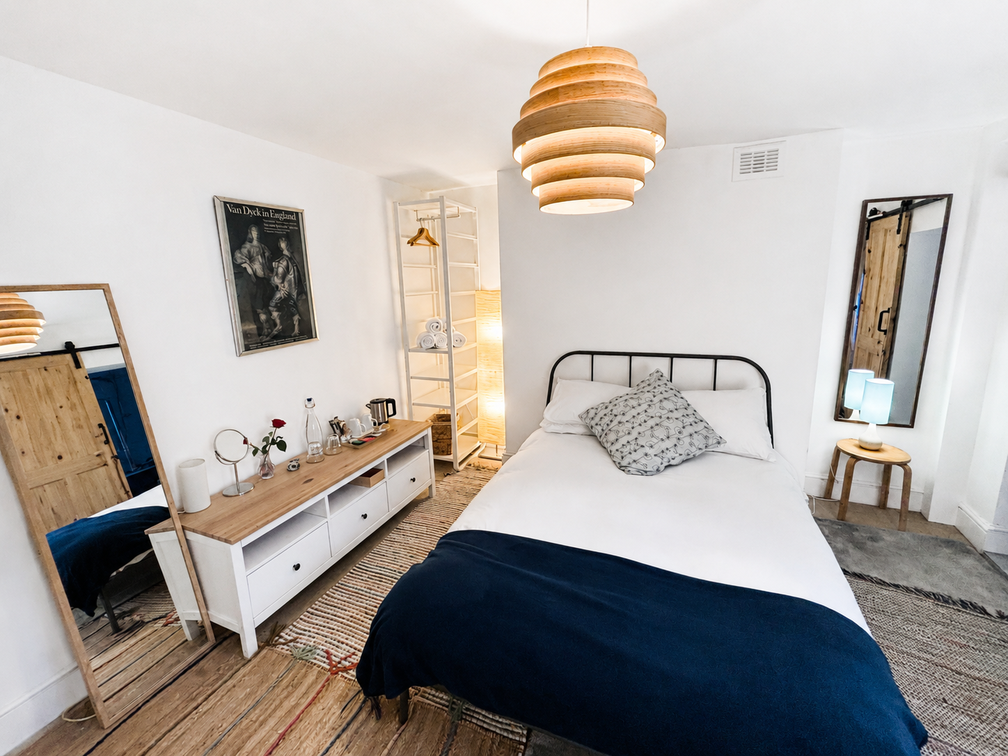 Room 7 ensuite double bedroom with white bedding and navy throw at Central Victorian House in Camden Town