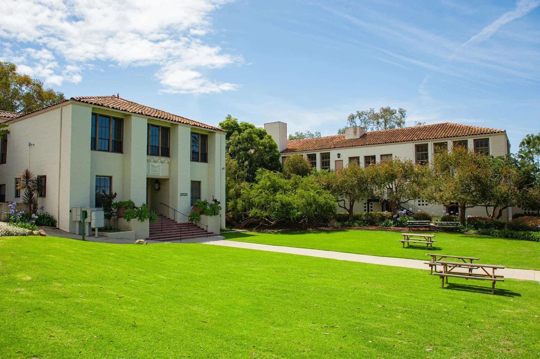 Broad lawn beside the buildings at Riviera Park