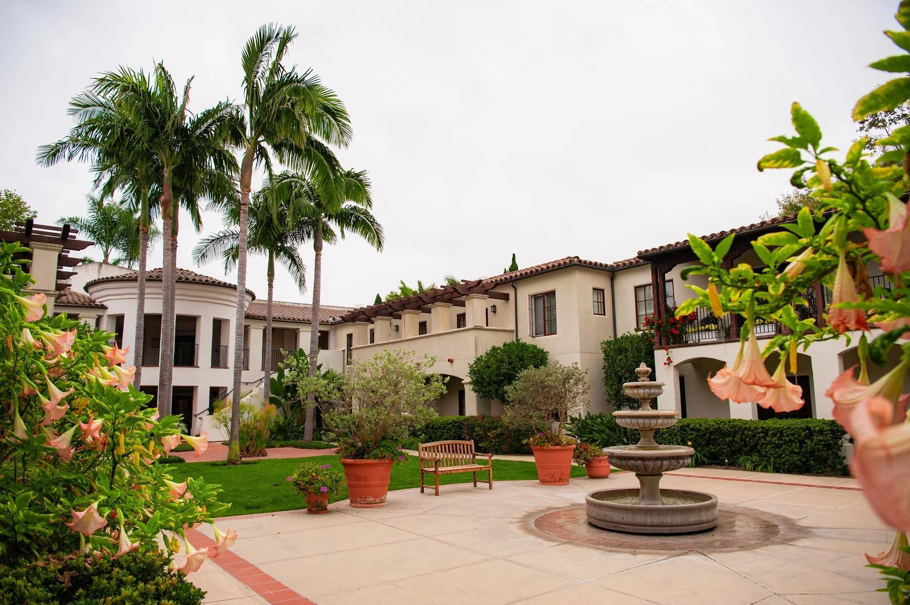 Fountain and palm trees in a Maravilla courtyard