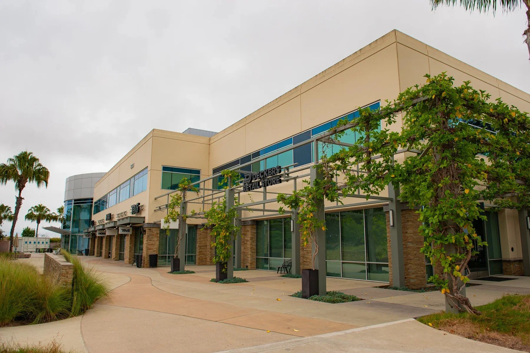 Vine-covered trellises along a landscaped pedestrian frontage at Cabrillo Business Park