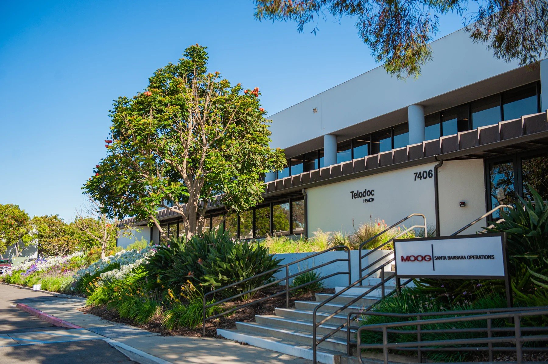 Steps and planted approach to the 7406 Hollister building