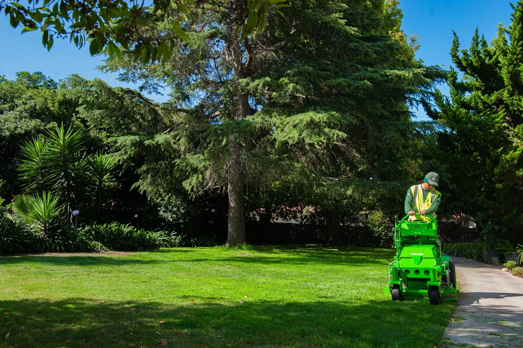 A Kitson crew member mowing the lawn at Encina Royale