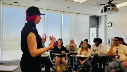 Satine teaching a classroom