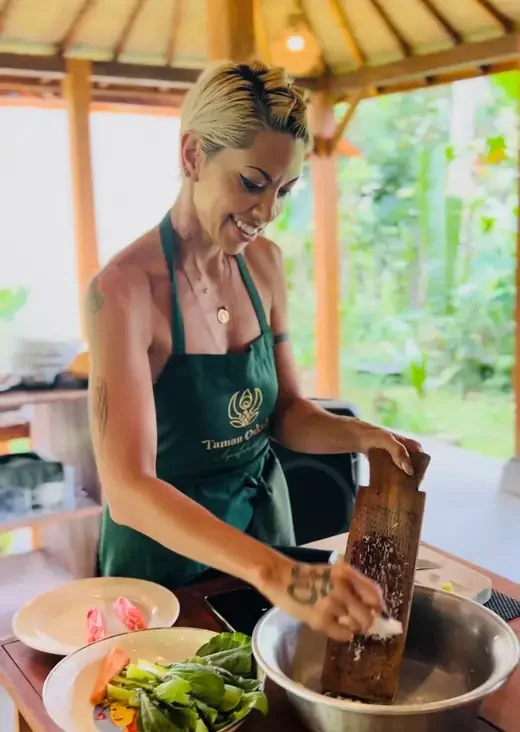 Satine cooking in her kitchen