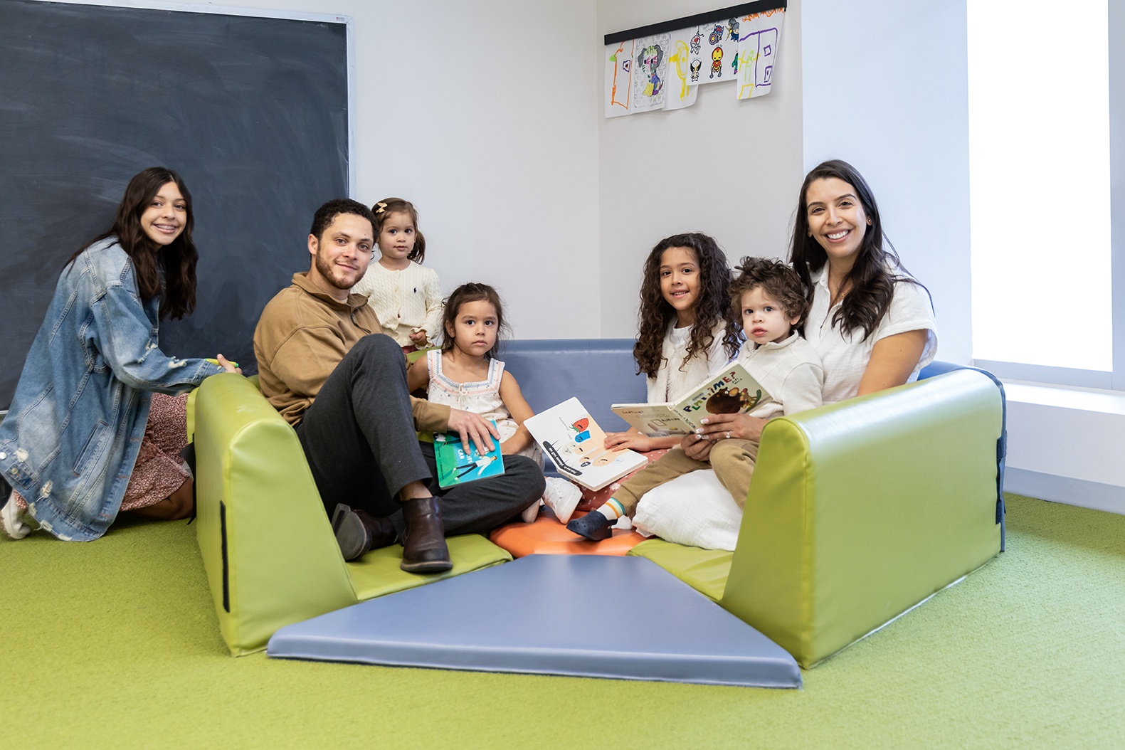 Parents and children spending time together in a welcoming library space