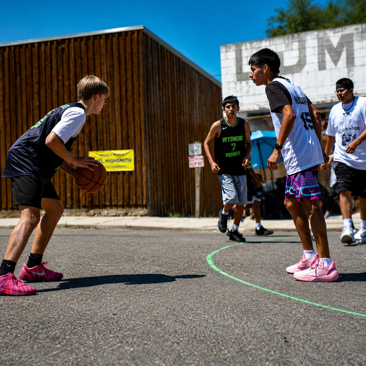 Wyoming Premier Hoops player protecting the basketball