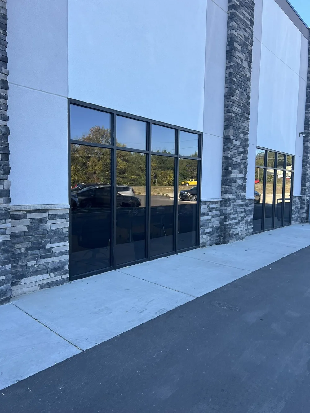 Commercial building storefront with tinted glass installed by Perfect Shade