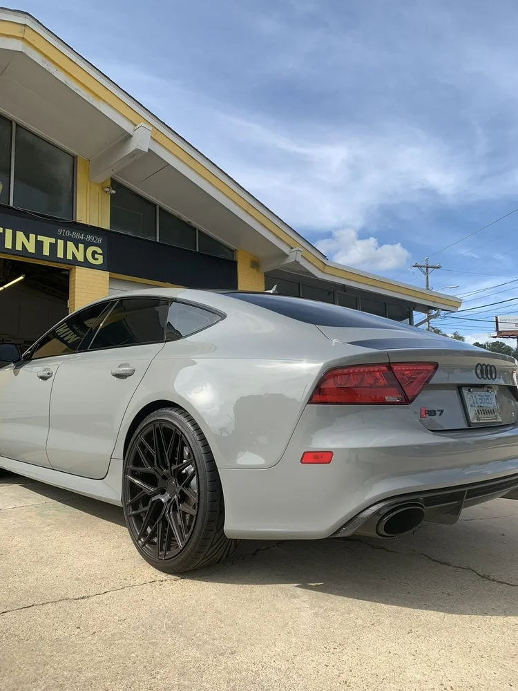 Grey Audi Sportback with tinted windows outside Perfect Shade