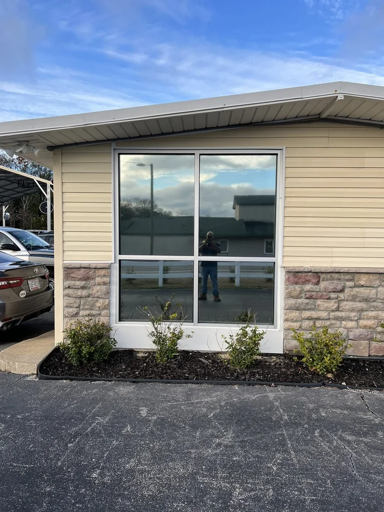 Residential window with flat-glass tint film installed by Perfect Shade