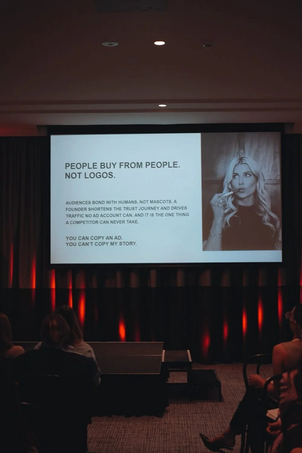 Britt's keynote slide: People buy from people. Not logos.