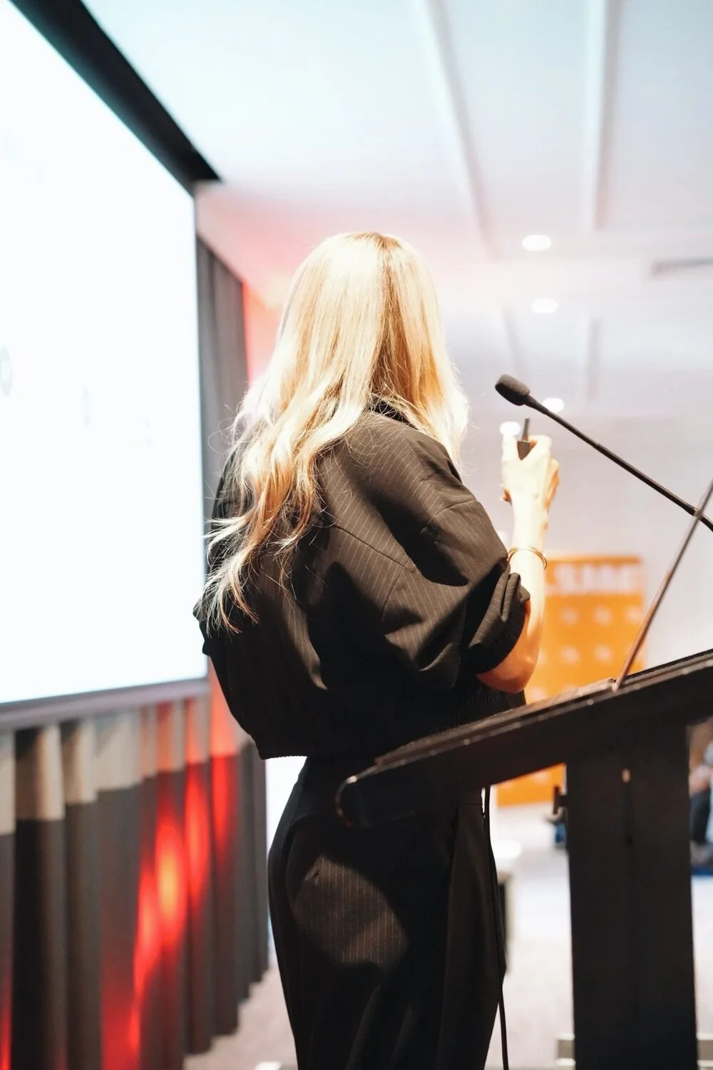 Britt at the podium during a keynote