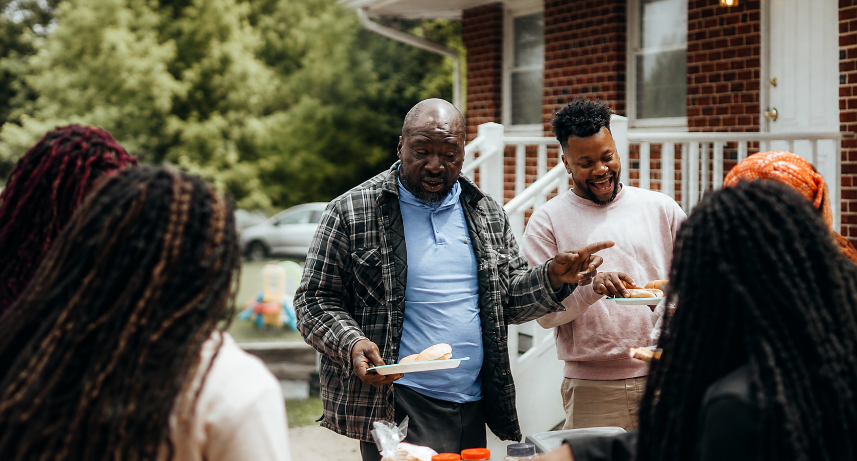 Men enjoying a backyard meal together while supporting healthy blood sugar and metabolic health