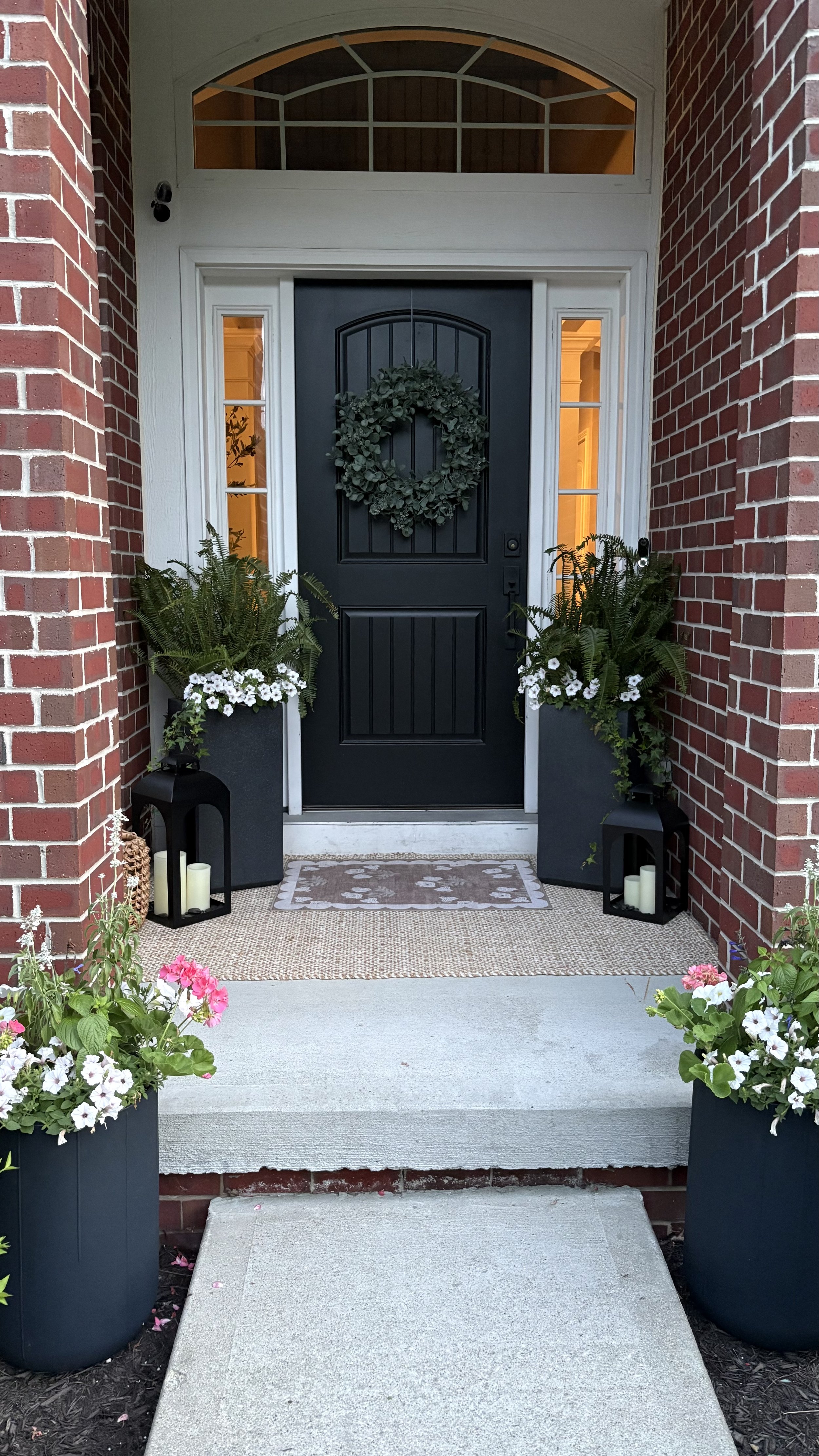 Curated seasonal porch décor and greenery