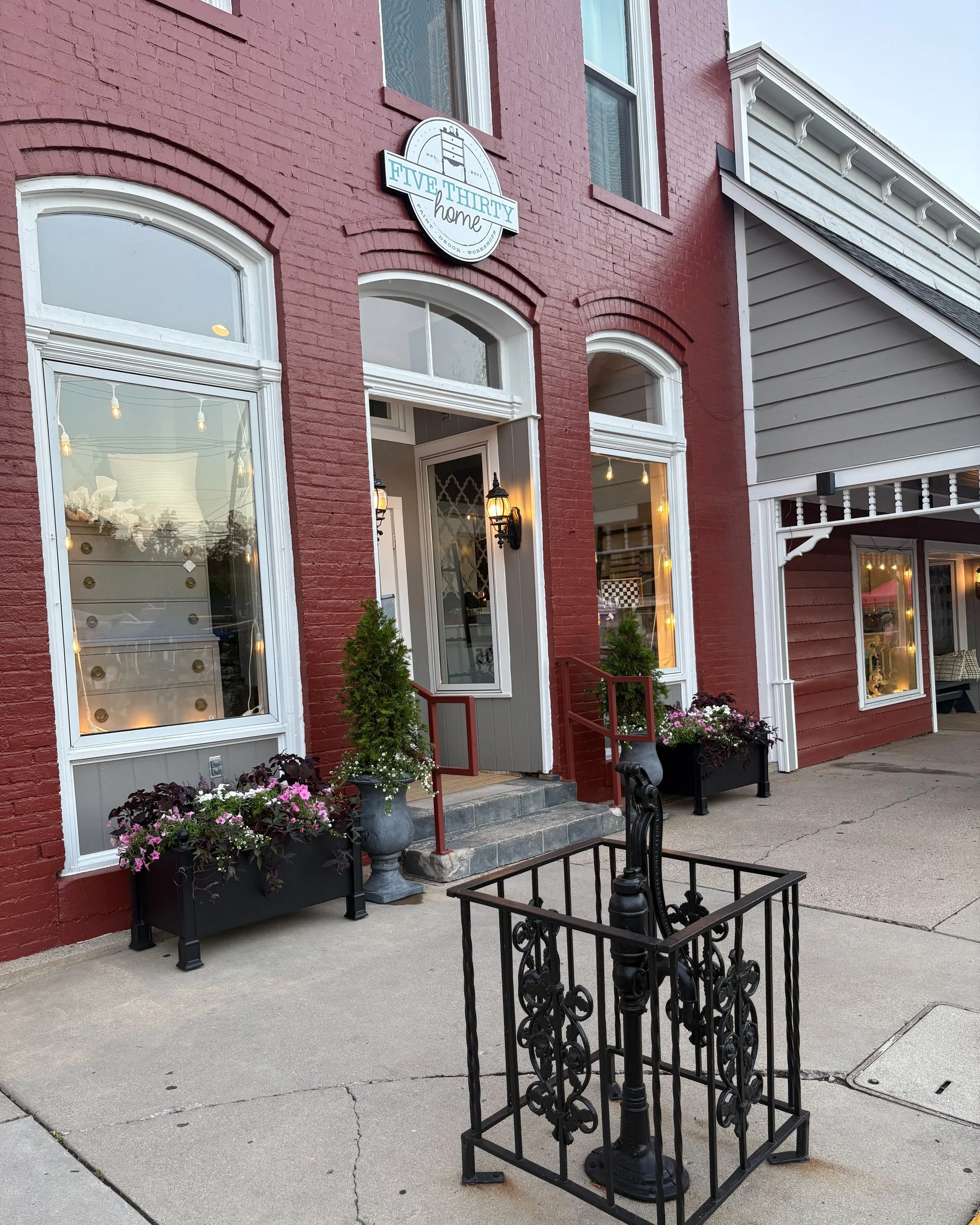 Seasonal planters professionally installed at a storefront
