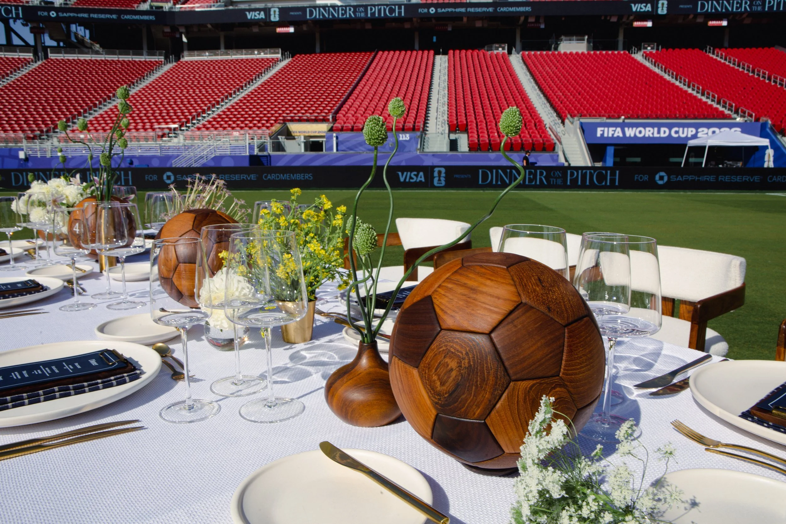 Dinner on the Pitch, Table set on the pitch, screen above