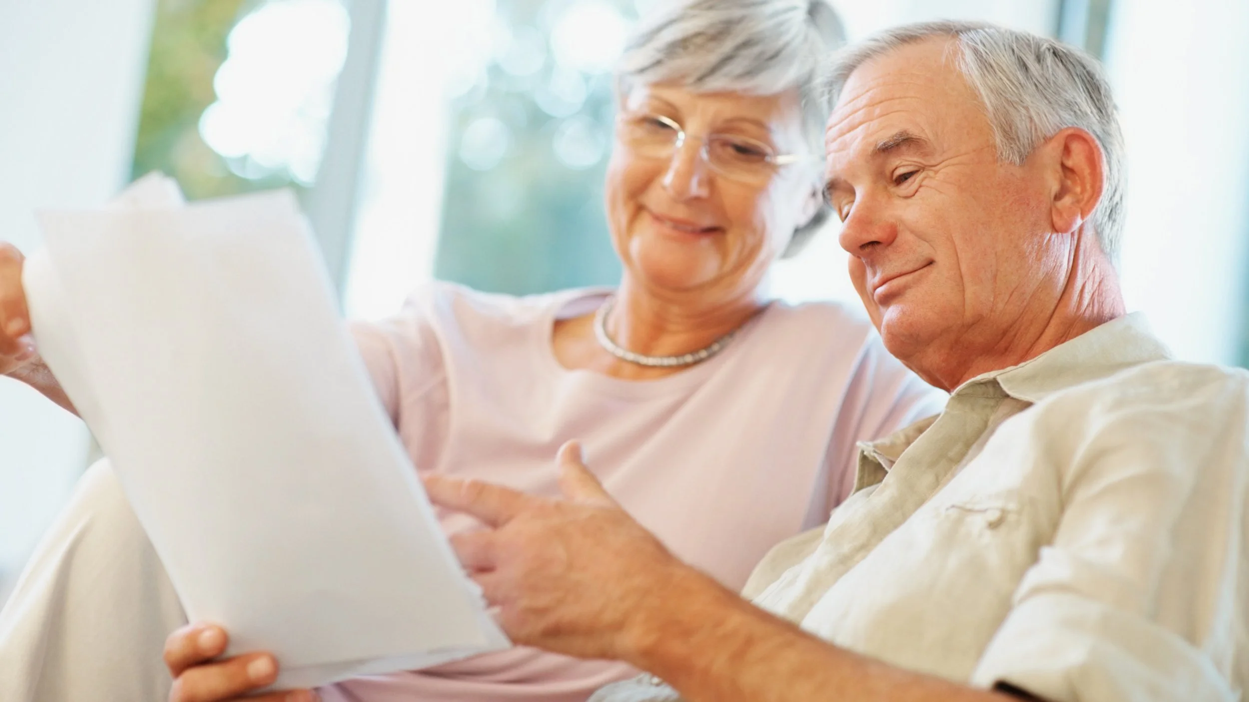 Couple reviewing financial paperwork together