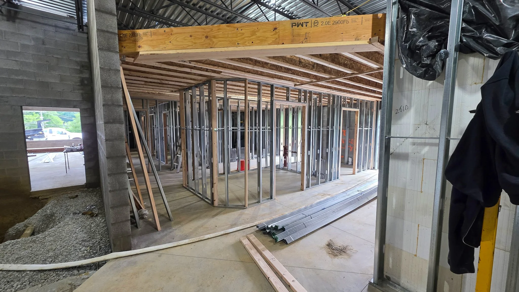 Laminated wood beam and steel stud partitions during interior framing at the Common Ground Kitchen and Taps build in Peters Township, PA.