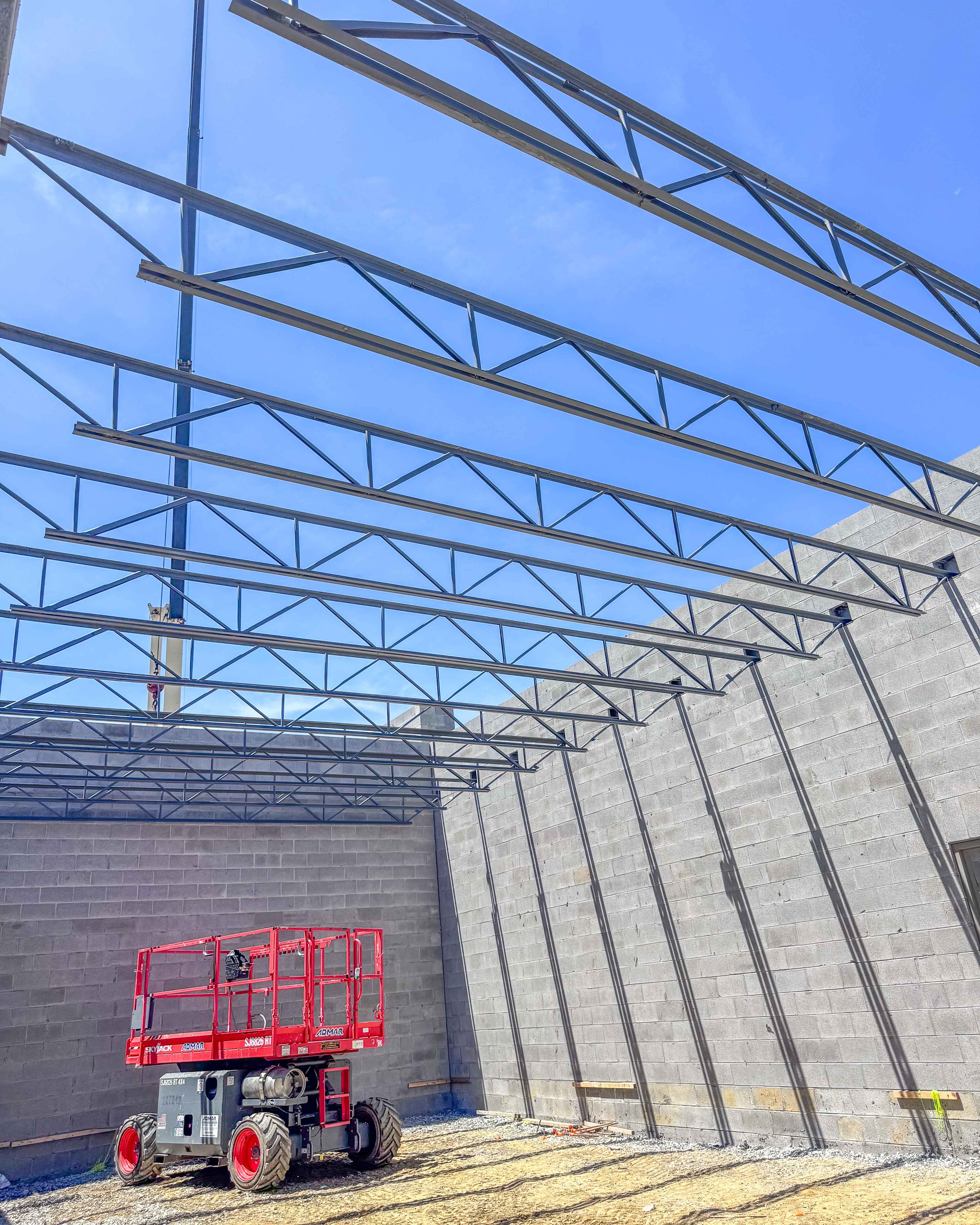 Steel roof joists installed across the concrete block structure of Common Ground Kitchen & Taps in McMurray, PA.