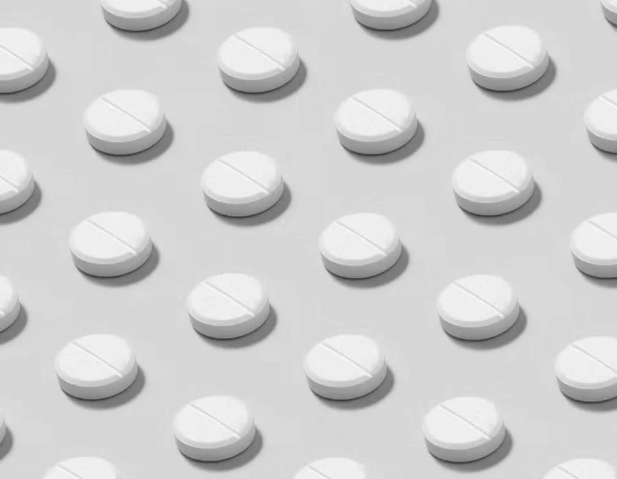 Pills illustrating an Oprah Daily article on hormone therapy and breast cancer