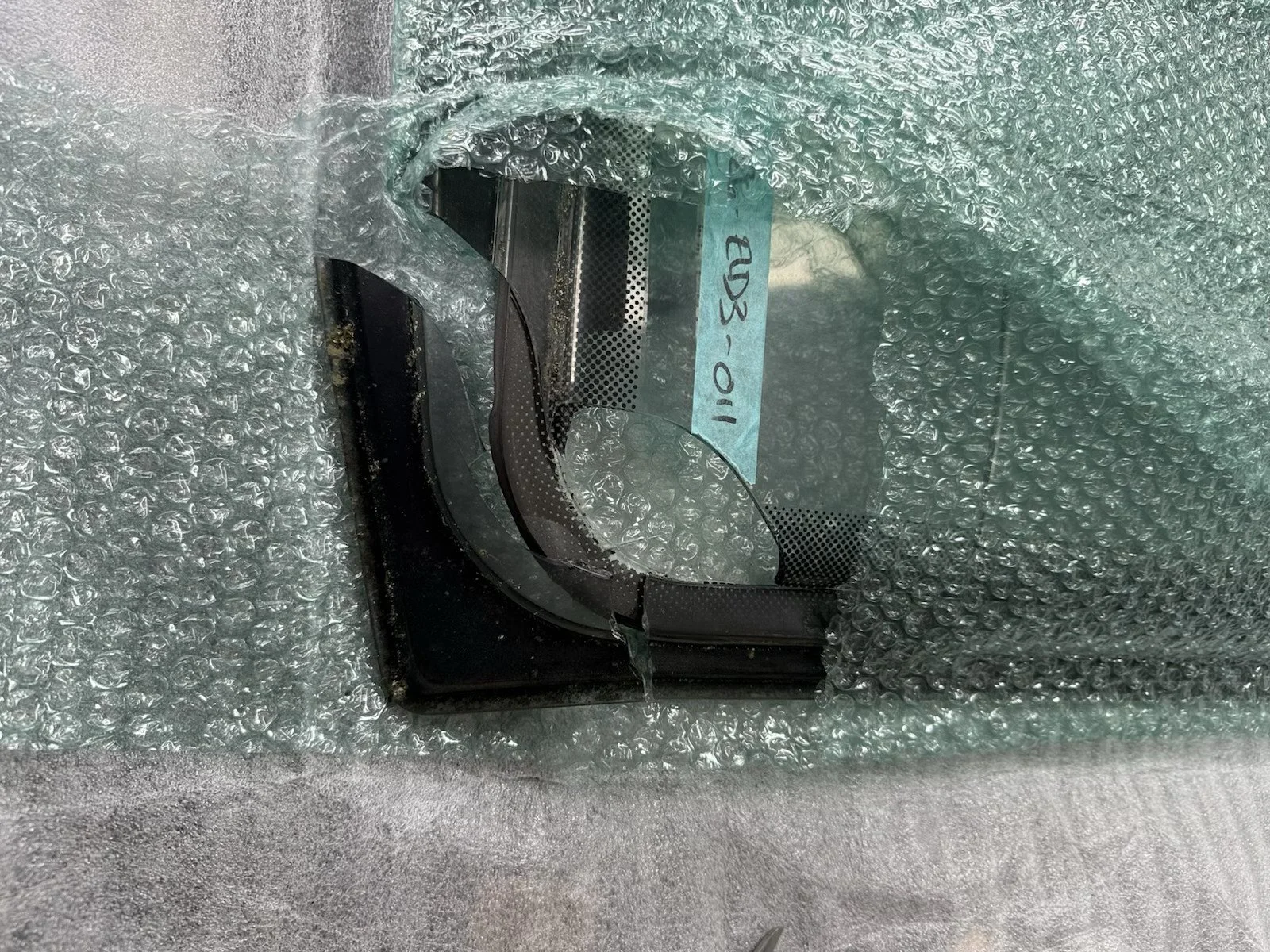 Shattered caravan window hinge rail damaged during delivery transit