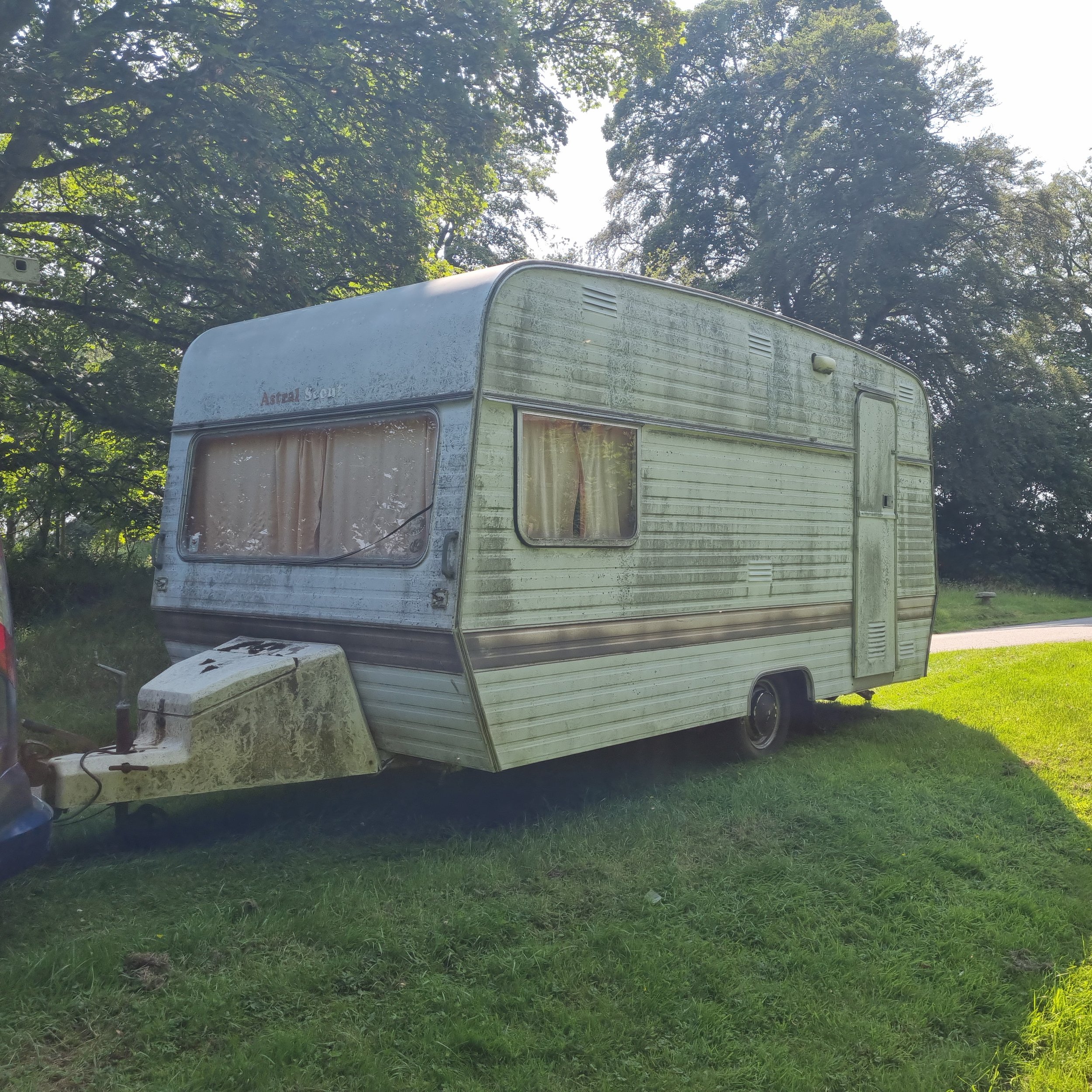 1974 Astral Scout vintage caravan sitting on a driveway prior to recovery