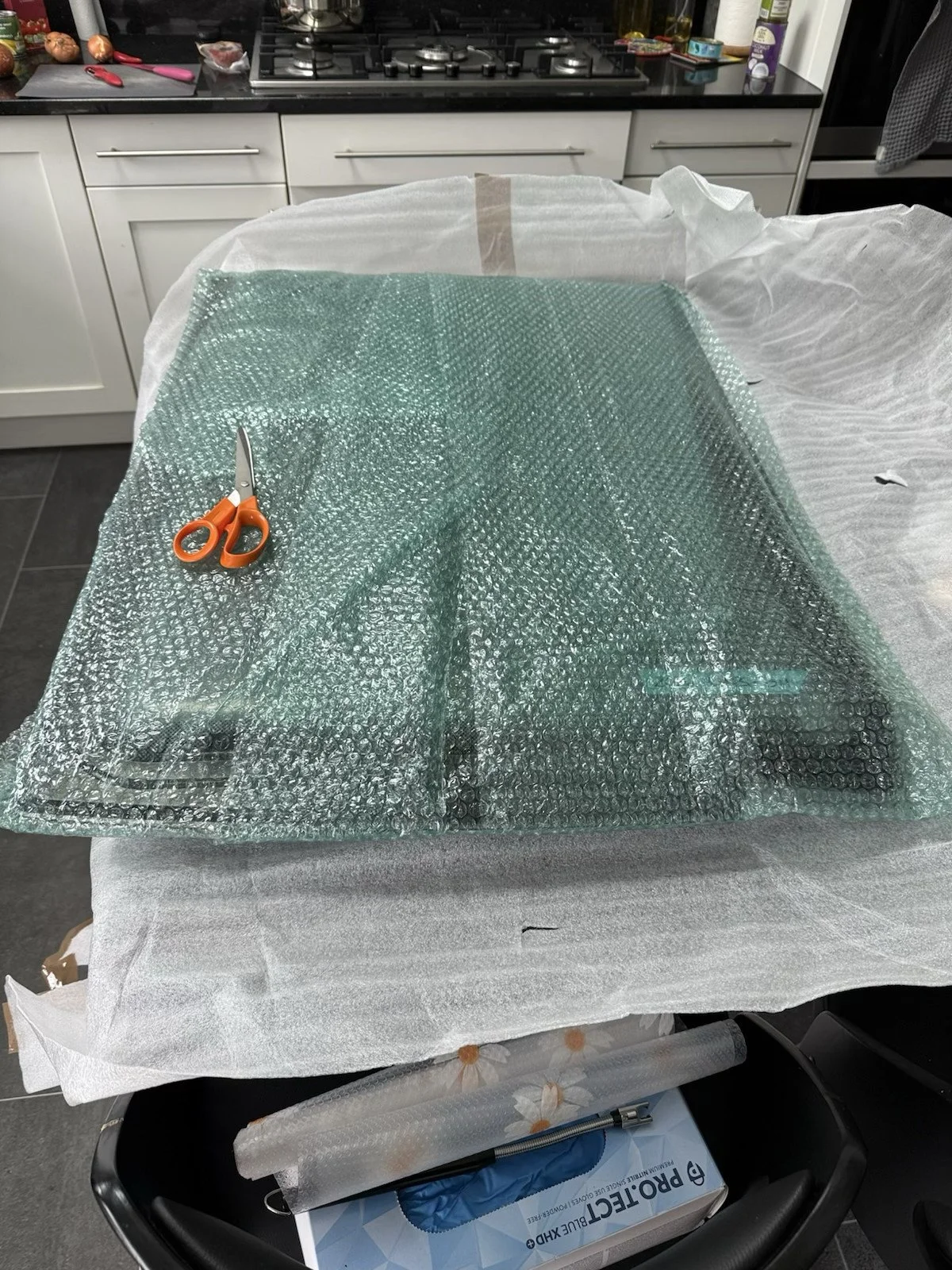 Heavy duty industrial bubble wrap application on a used caravan window
