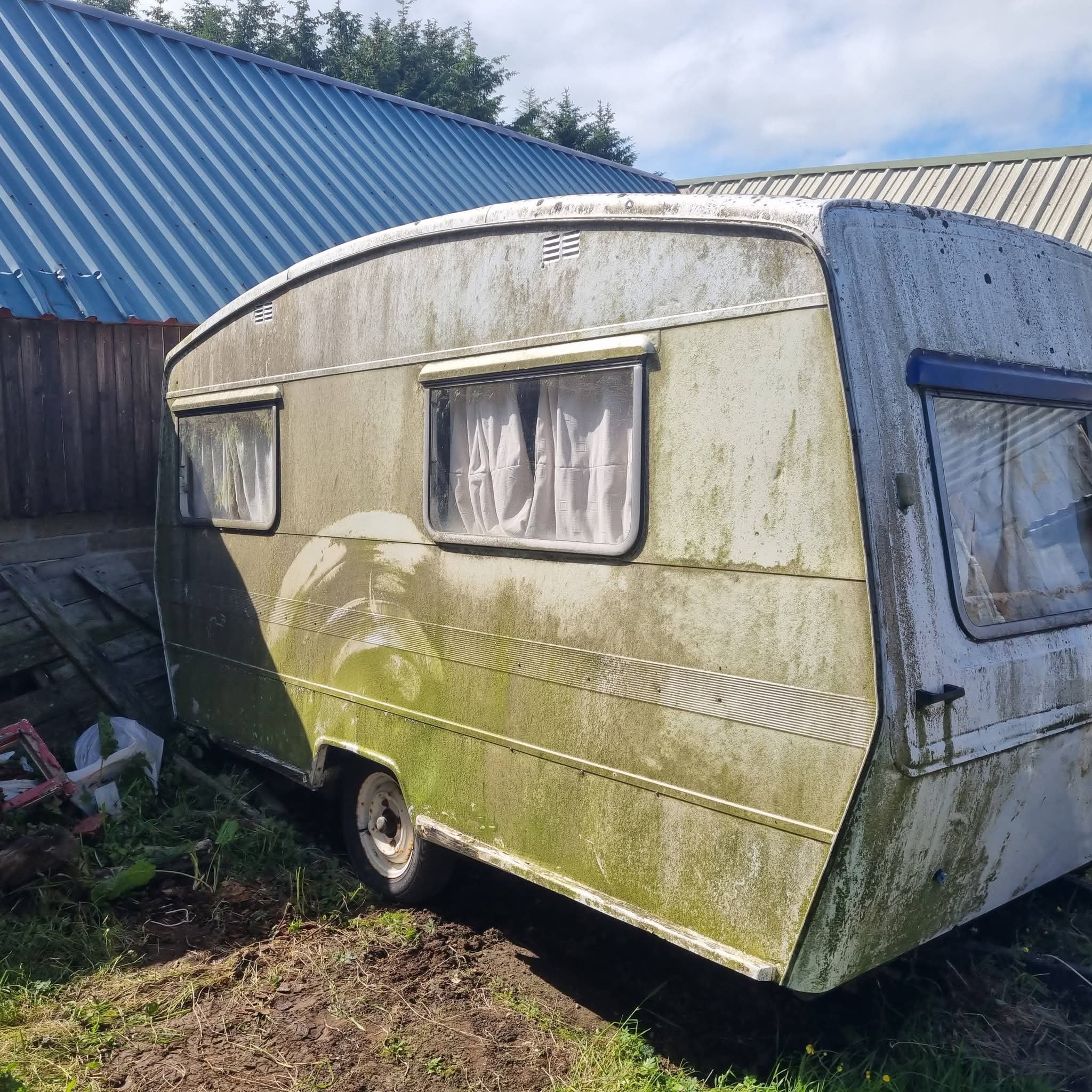 Side profile of the classic CI Sprite Alpine showing its iconic curved roofline