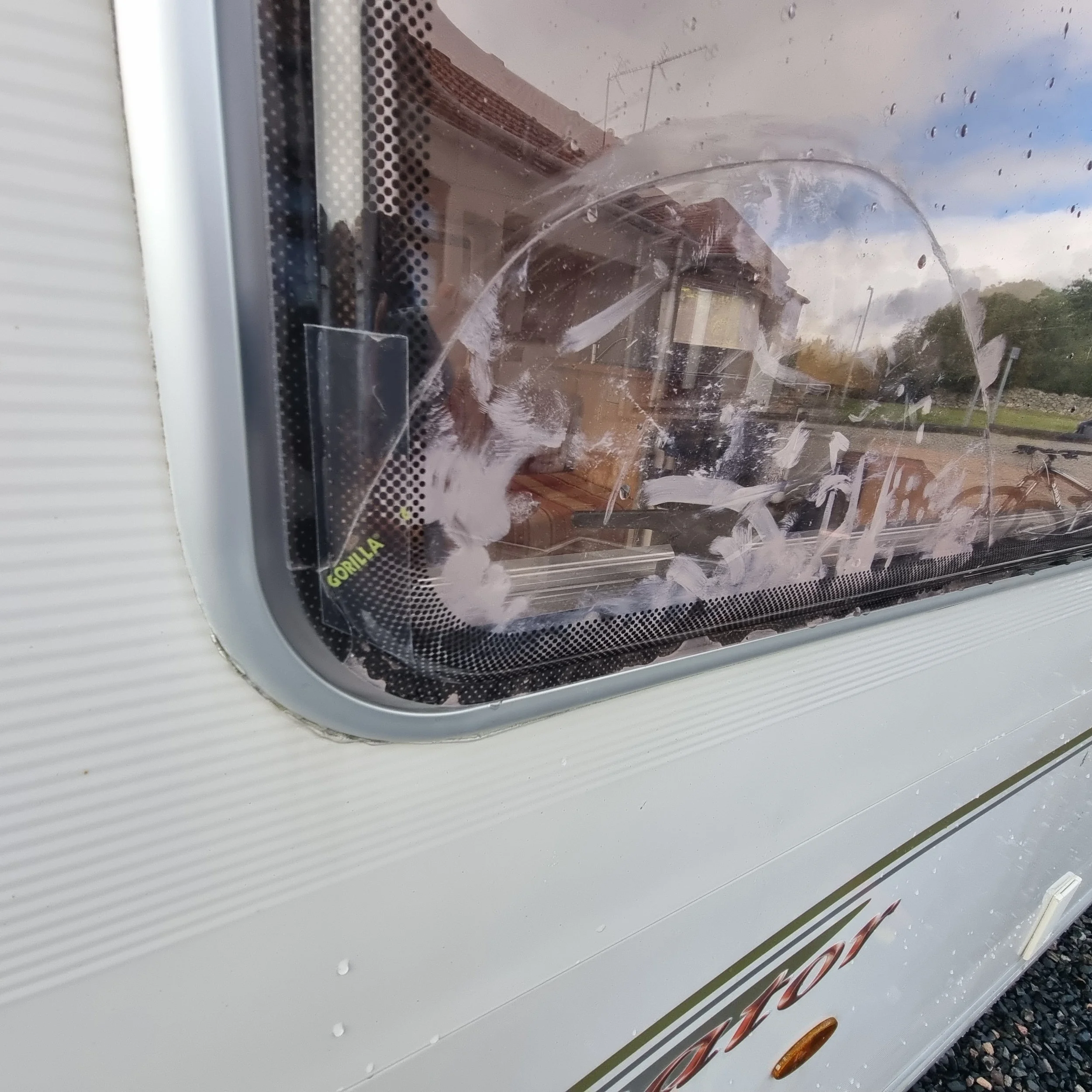 Damaged window on a Bailey Senator Carolina caravan before repair