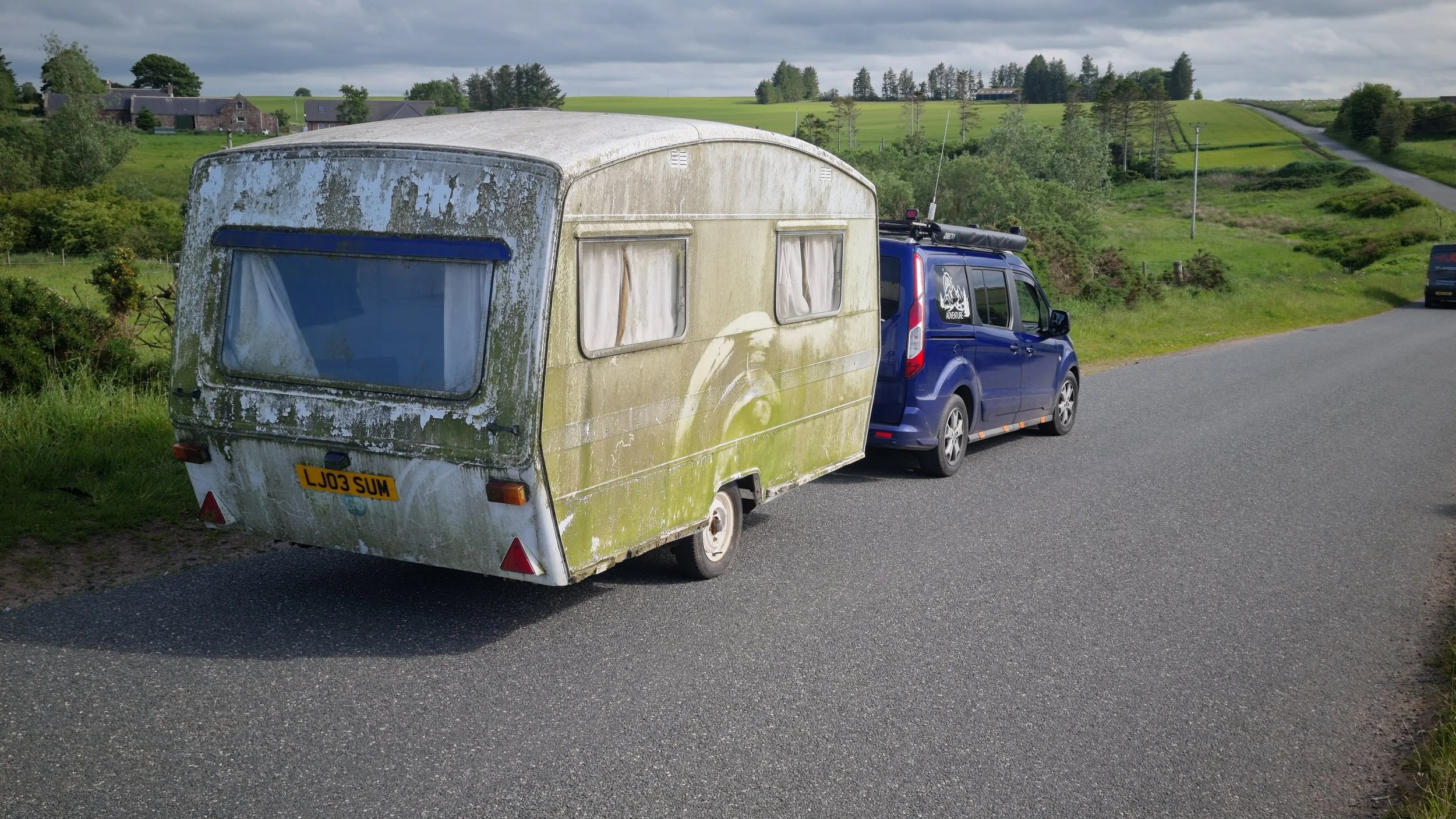 1970s Sprite Alpine Caravan covered in moss as found on an Aberdeenshire farm
